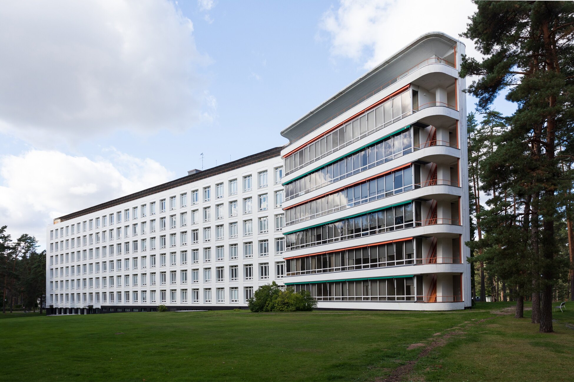 The long facade of Paimio Sanatorium among the pines